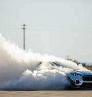 Ford says its all-electric Mustang Mach-E 1400 prototype race car can hit 1,400 horsepower. The prototype race car is powered by seven motors and a 56.8-kilowatt-hour battery.
