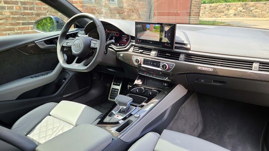 The interior of the 2020 Audi S5 Sportback is a pleasant place to be with quilted leather seats, digital screens and a T-shifter.