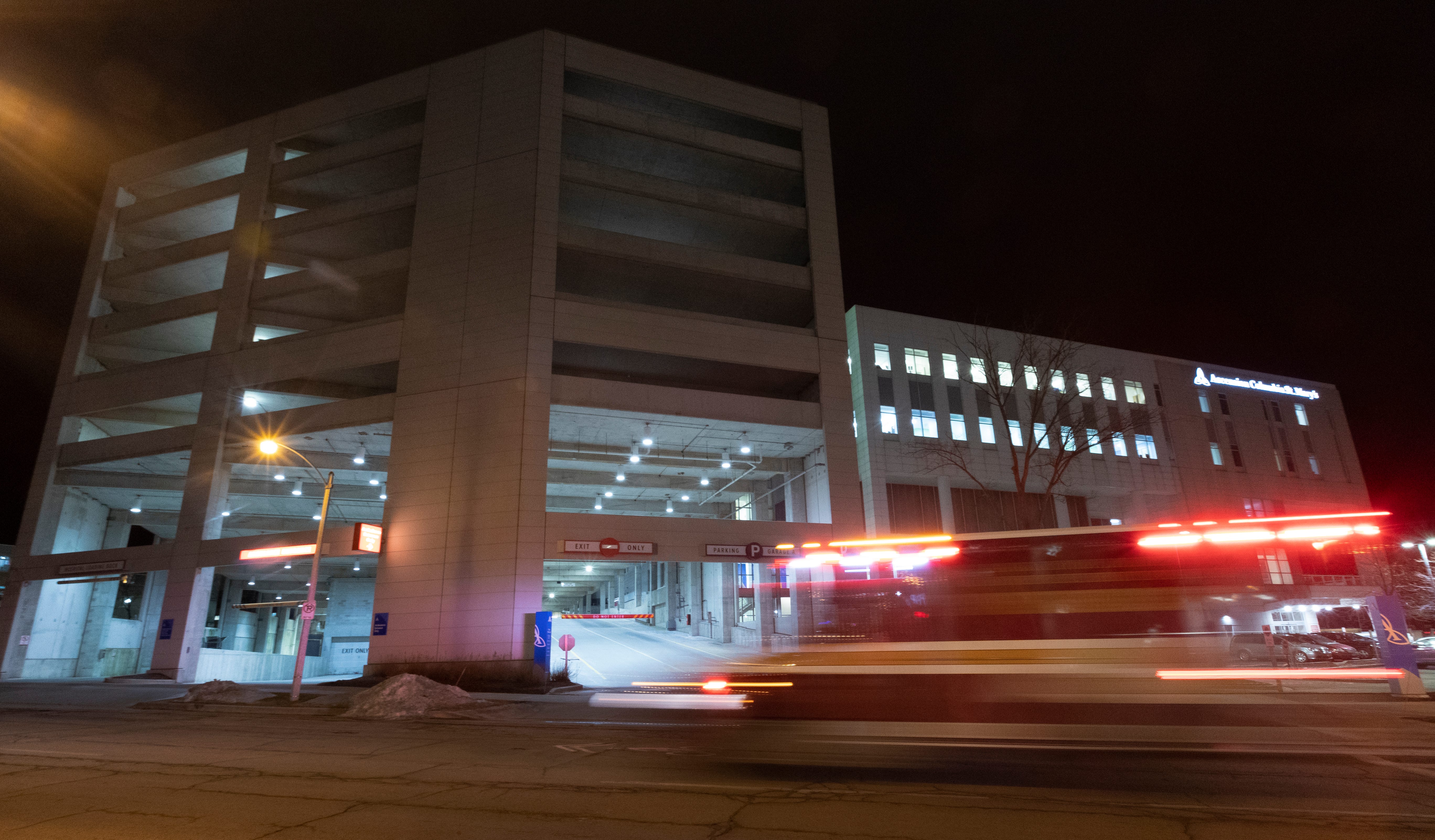 An ambulance passes the entrance to a parking ramp at Ascension Columbia St. Mary's Hospital Milwaukee Tuesday, February 25, 2020 in Milwaukee, Wis. The Milwaukee Journal Sentinel enlisted the aid of an architectural security consultant to evaluate parking ramps at five Milwaukee hospitals.