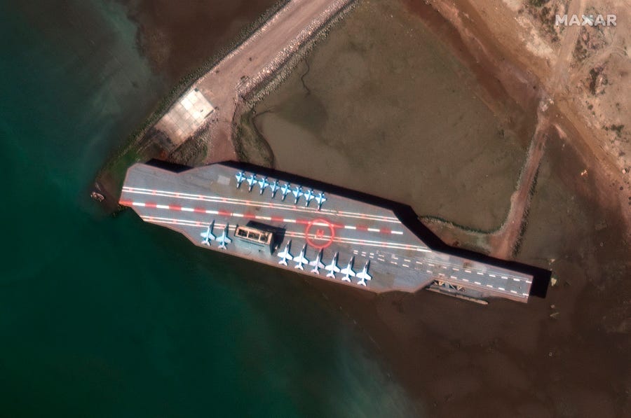 A mock-up aircraft carrier built by Iran is seen at the port of Bandar Abbas, Iran, before being put out to sea on July 27, 2020.