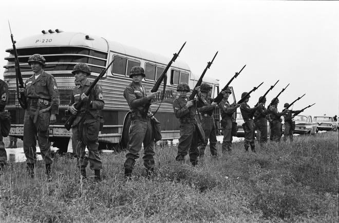 National Guard members protecting the bus for the Freedom Riders leaving Montgomery, Alabama, for Jackson, Mississippi.