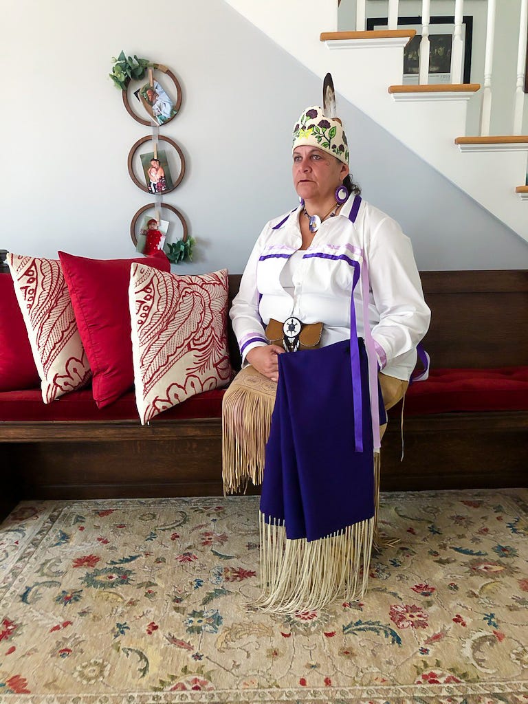 Jessie "Little Doe" Baird, a citizen of the Mashpee tribe, wears Wampanoag regalia. Baird is a linguist best known for her work to reclaim and teach the Wampanoag language through the Wôpanâak Language Reclamation Project.