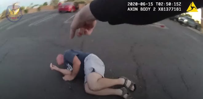 Body-worn camera footage of a Phoenix police officer shooting a man with a knife who allegedly threatened customers and an officer in a parking lot in Glendale in June was released on Thursday.