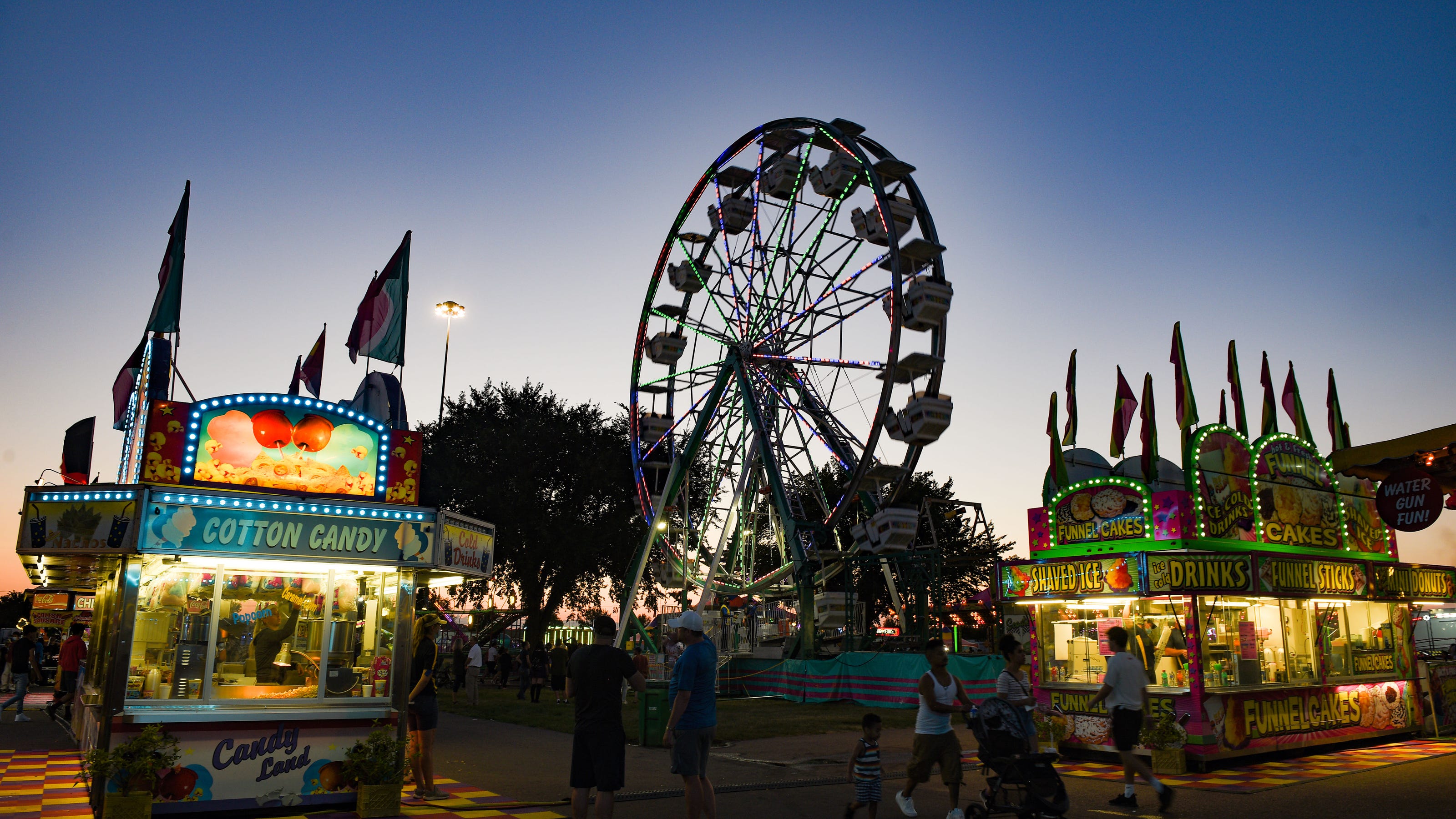 Crowds remain as the sun sets on the first day of the Sioux Empire Fair
