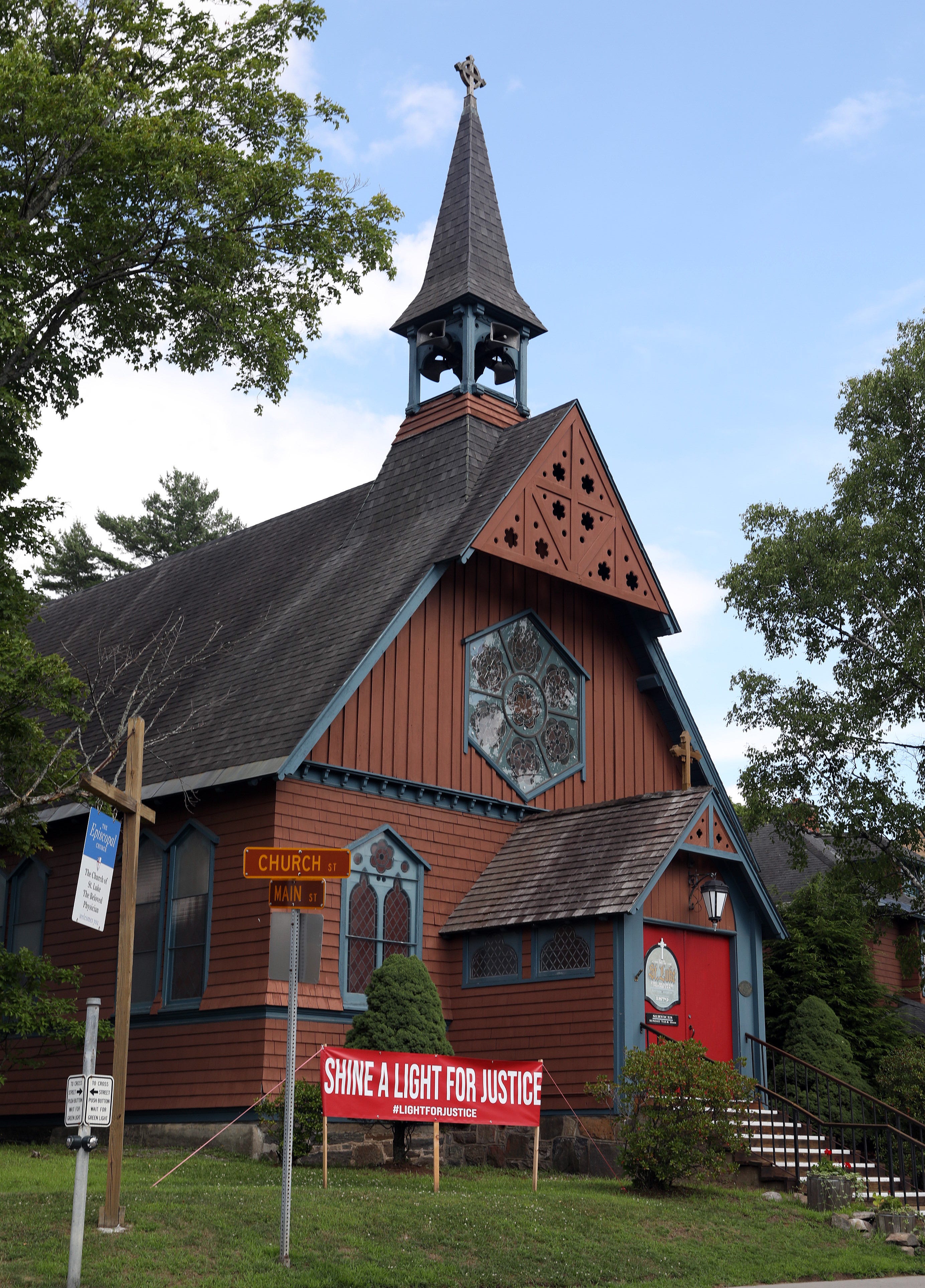 A sign outside the Church of St. Luke The Beloved Physician on Church Street in Main street in Saranac Lake July 28, 2020.