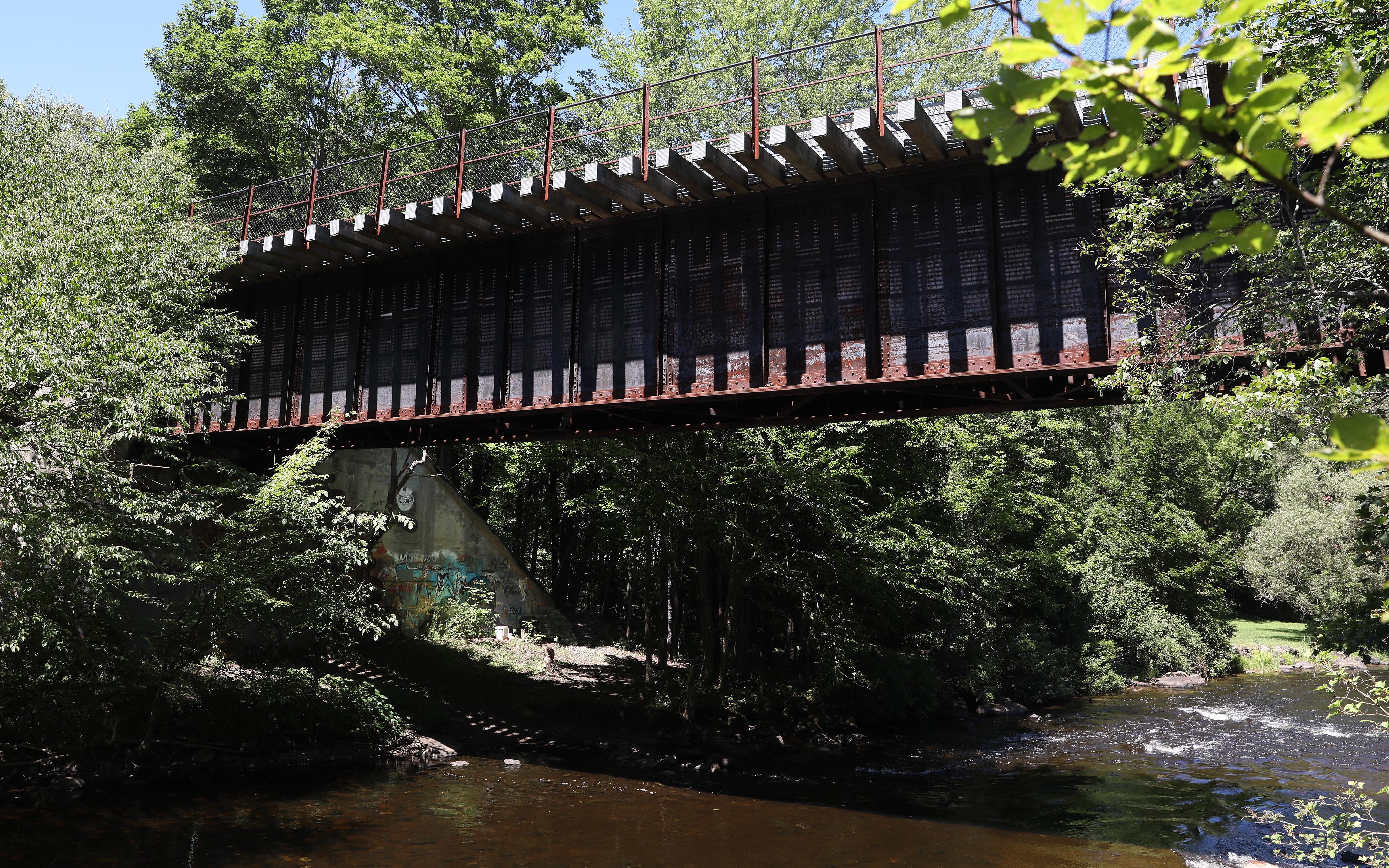 An old railroad trestle over the Saranac River in downtown Saranac Lake July 28, 2020. 