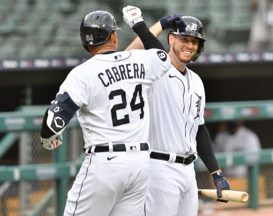 The Tigers' C.J. Cron, right, reacts with Miguel Cabrera after Cabrera's solo home run in the first inning of a game last week at Comerica Park.