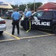 Lansing officers work at the scene of a shooting that left one man dead and another seriously injured on Monday, Aug. 3, 2020. The second man died Tuesday.