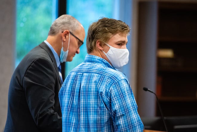 Clayton Ellis stands at the podium during a plea hearing in front of St. Clair County Circuit Judge Cynthia Lane Monday, Aug. 3, 2020, in the St. Clair County Courthouse in Port Huron. Ellis pleaded guilty to three counts of possession of child sexually abusive material Monday, Aug. 16, 2021.