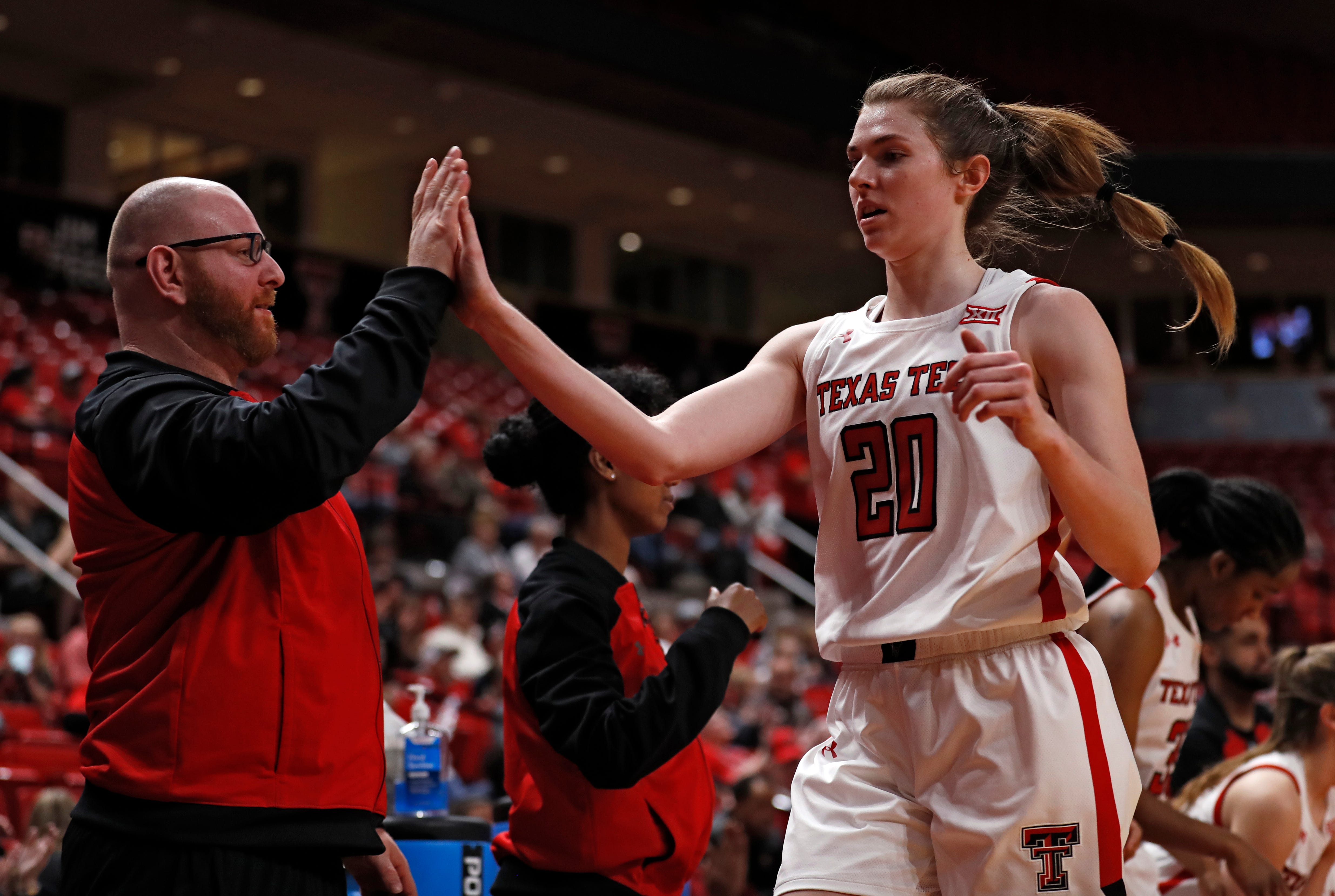 Ralph Petrella high-fives Brittany Brewer during a game in 2019.