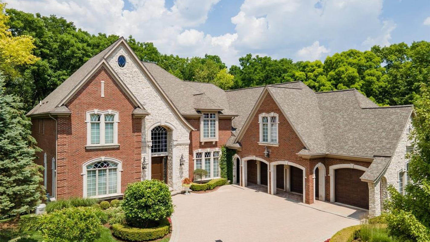 Tuscan estate has winding staircase and four-car garage