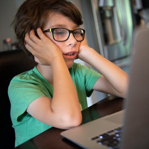 First grader Hawkes Powell tries to pay attention 