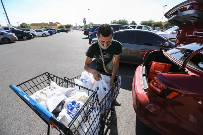 Arik Ruiz picks up food for an Instacart order from Albertsons in Las Cruces on Monday, August 4, 2020.