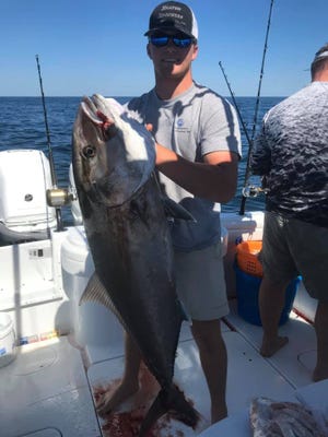 Jaxson Stafford with a nice amberjack he caught in May on a big live bait while fishing 70 miles from Pensacola Pass. Amberjack season re-opened Aug. 1 in Gulf Coast waters.