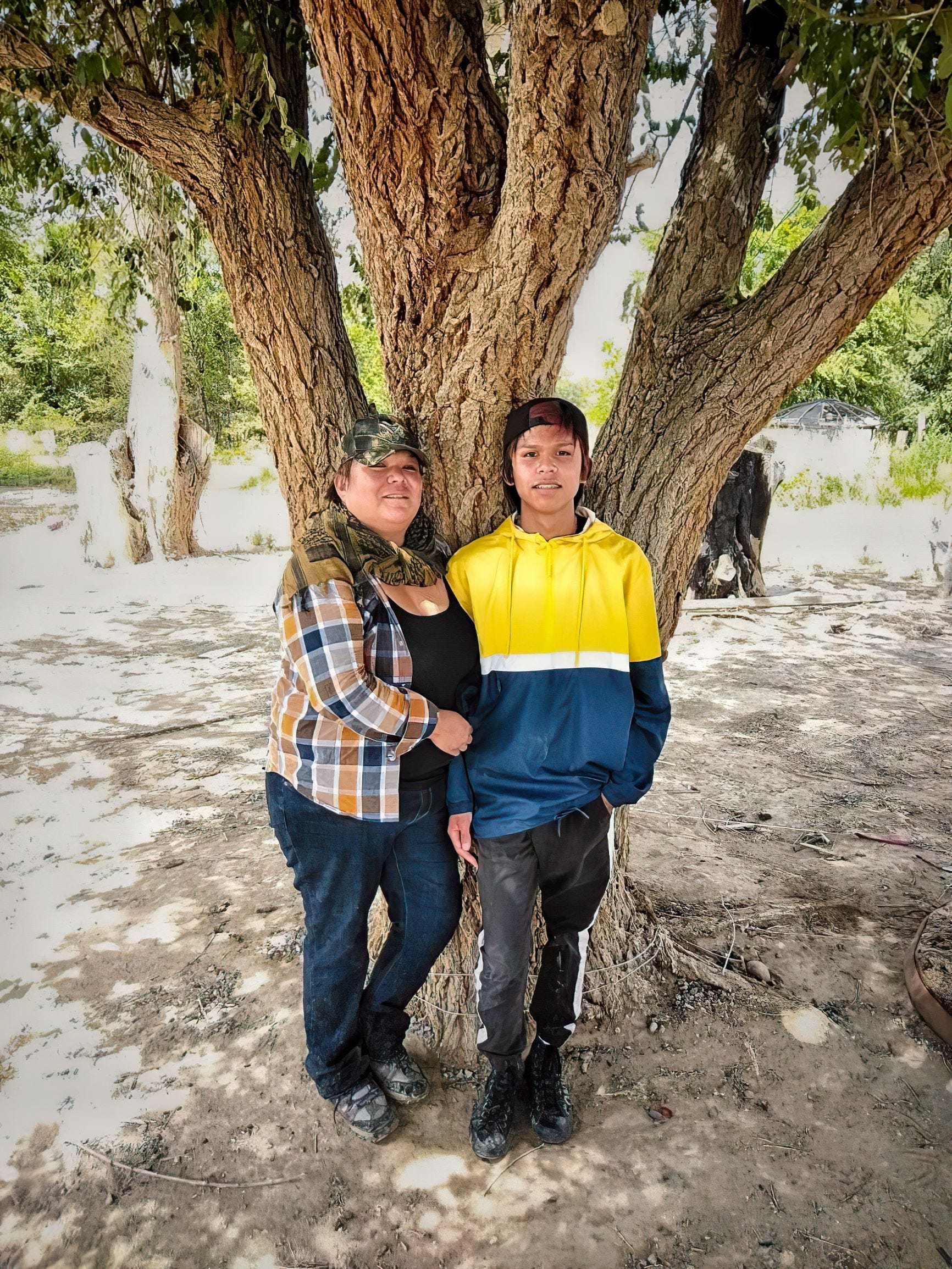 Carletta Lee and her son, Jacob, outside their home.