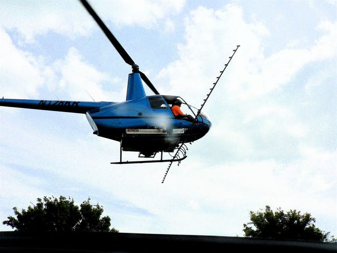 The helicopter arriving from the field for a resupply.