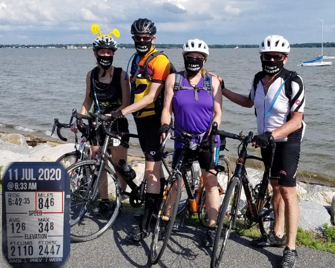 From left: Susan Epstein, David Epstein, Lynn Shapira and Nadiv Shapira at Battery Park after finishing their over 84-mile ride.
