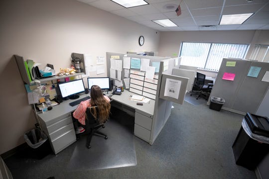 Workers at COPE (Community Outreach for Psychiatric Services), a mental health crisis clinic run by Hegira Health, staff the facility's dispatch center, August 5, 2020.