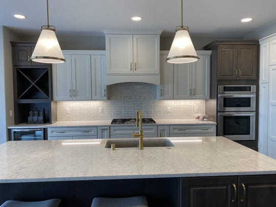 Oversized kitchens with islands can be gathering spots, as shown in the Aspen Homes model, at  AeroPark in Menomonee Falls.