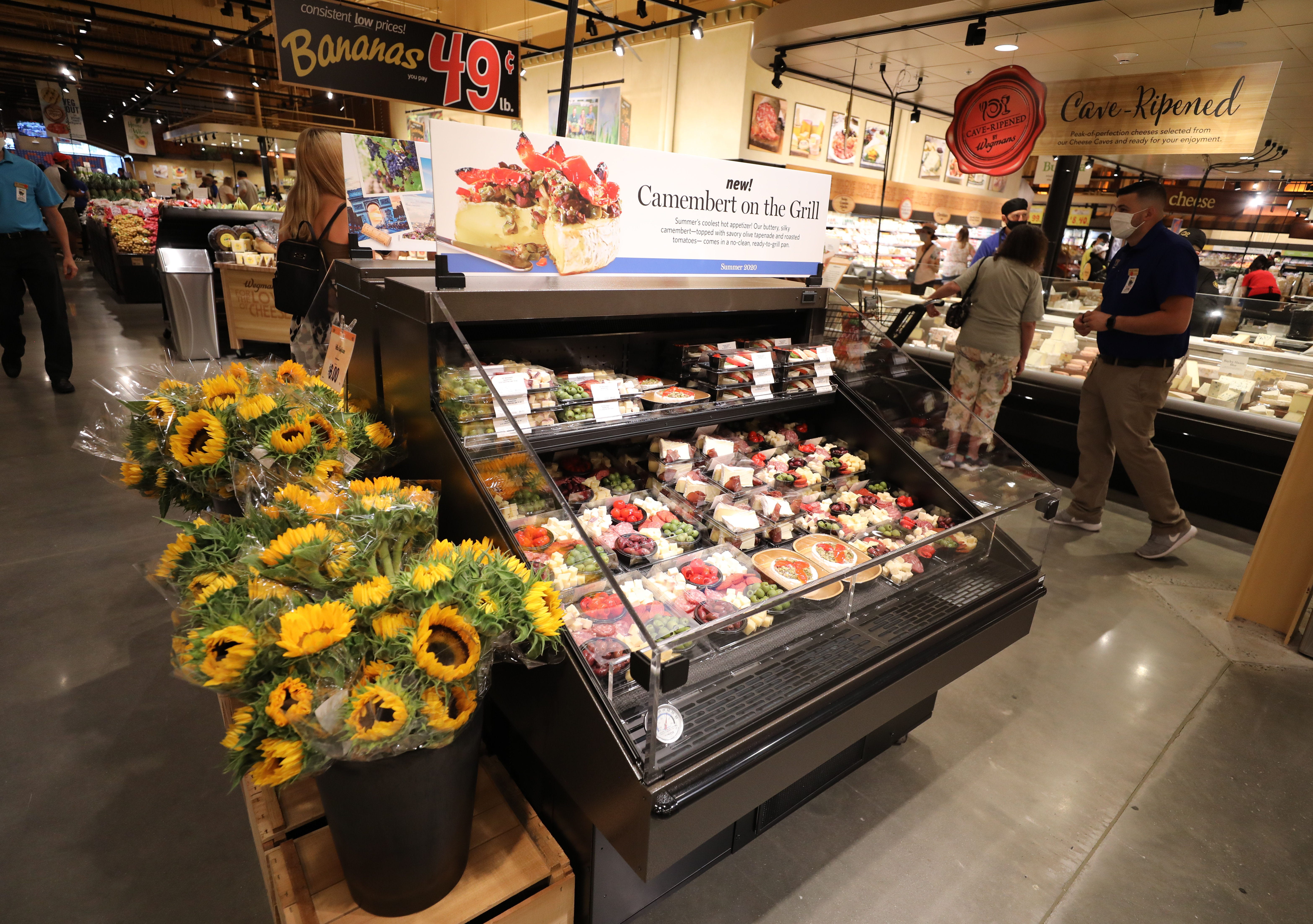 Flowers, cheese and fruit on display on the opening day of the Wegmans in Harrison, New York, on Aug. 5, 2020.