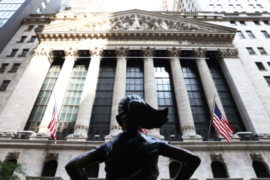 The "Fearless Girl" statue in front of the New York Stock Exchange (NYSE) at Wall Street on July 23, 2020 in New York City.