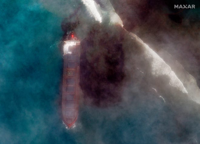 This satellite image provided by 2020 Maxar Technologies on Friday presents an aerial view of oil leaking from the MV Wakashio, a bulk carrier ship that recently ran aground off the southeast coast of Mauritius. Prime Minister Pravind Jugnauth said the government has appealed to France for help with a brewing environmental disaster after a ship that ran aground almost two weeks ago off the Indian Ocean island nation began leaking oil. [The Associated Press]