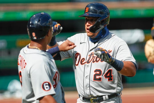 Detroit Tigers' Miguel Cabrera, right celebrates with Jonathan Schoop after driving him in with a two run home run in the first inning of a baseball game against the Pittsburgh Pirates, Saturday, Aug. 8, 2020, in Pittsburgh. This was the second of four home run Pirates starter Derek Holland gave in the Tigers five run first. (AP Photo/Keith Srakocic)