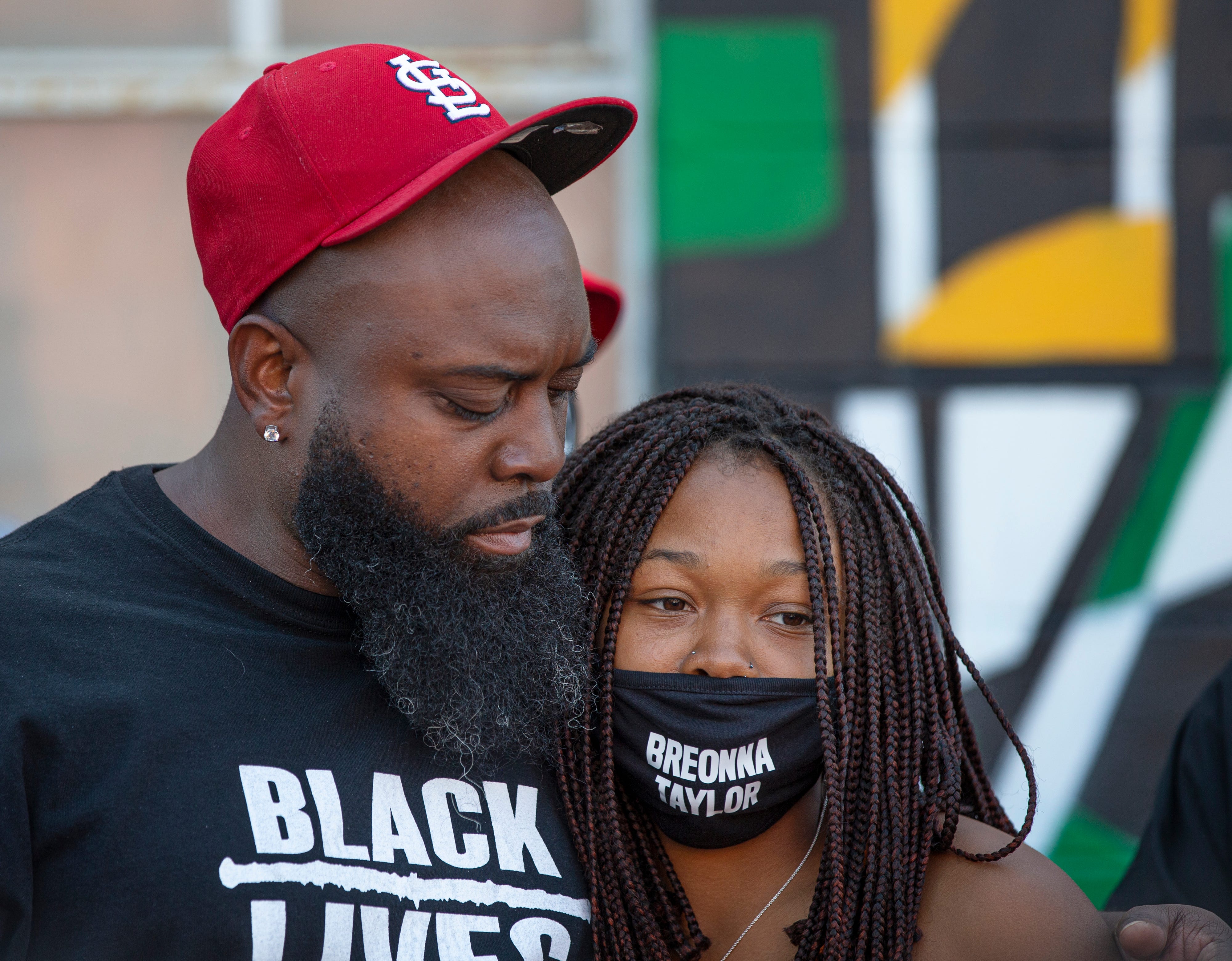 Michael Brown Sr. hugs Ju'Niyah Palmer at the Until Freedom rally Louisville, Kentucky on Aug. 8, 2020. Both lost loved ones in police shootings: Michael Brown Jr. in Ferguson, Missouri in 2014 and Breonna Taylor in March 2020.