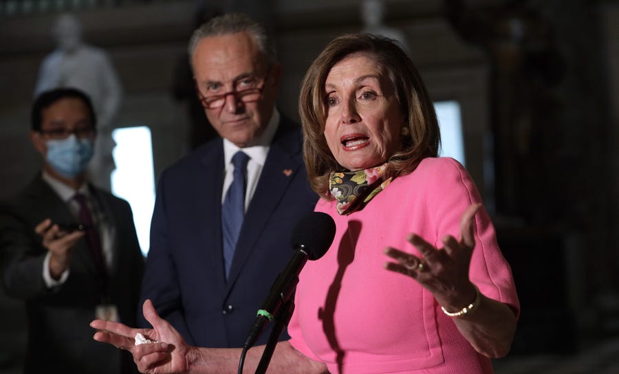 House Speaker Nancy Pelosi, D-Claif., and Senate Minority Leader Charles Schumer, D-N.Y., speak to members of the press after a meeting with Treasury Secretary Steven Mnuchin and White House Chief of Staff Mark Meadows at the U.S. Capitol Aug. 7, 2020 in Washington.