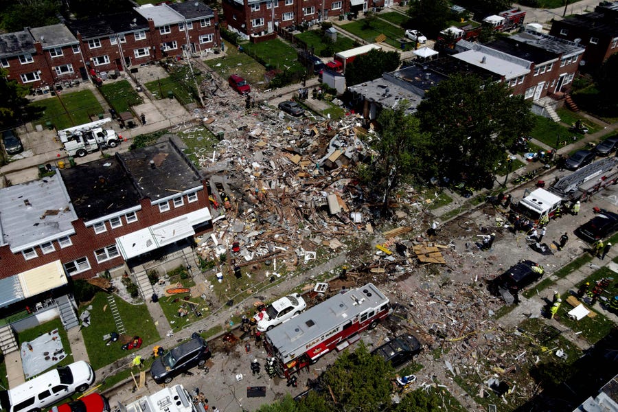 Debris and rubble covers the ground in the aftermath of an explosion in Baltimore on Monday, Aug. 10, 2020. Baltimore firefighters say an explosion has leveled several homes in the city.
