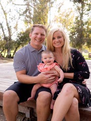 Ryan Kwiatkowski, 33, his wife, Caroline, and their daughter, Charlotte.