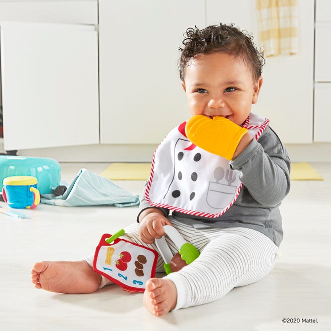 The New Fisher-Price Cutest Chef Gift Set ($14.99, available now) has a chef's apron bib, chewable oven mitt, tongs with a spinning meatball, and a recipe card.