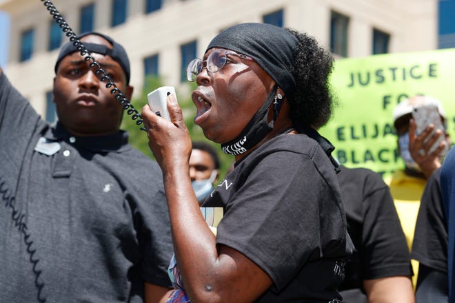 In this June 27, 2020, file photo, Sheneen McClain speaks during a rally and march over the death of her son, Elijah McClain, outside the police department in Aurora, Colo. The parents of Elijah McClain, a 23-year-old Black man who died after officers in suburban Denver stopped him on the street last year and put him in a chokehold, sued police and medical officials Tuesday, Aug. 11.