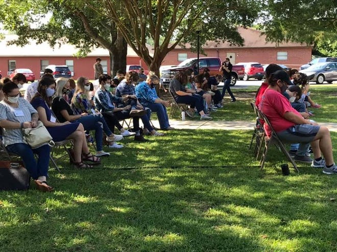 A time of prayer outside with new students and Dr. Kinchen