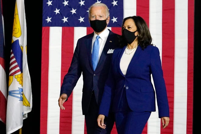 Democratic presidential candidate former Vice President Joe Biden and his running mate, Sen. Kamala Harris, D-Calif., arrive to speak at a news conference at A.I. du Pont High School in Greenville on Wednesday, Aug. 12, 2020.