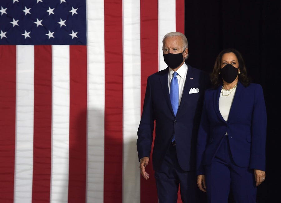Democratic presidential nominee and former US Vice President Joe Biden and vice presidential running mate, US Senator Kamala Harris, arrive to conduct their first press conference together in Wilmington, Delaware, on August 12, 2020.