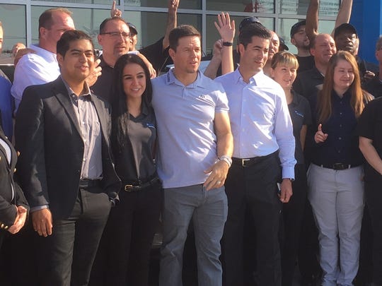 (In the center) Mark Wahlberg and Jay Feldman met with the Mark Wahlberg Chevrolet dealership team in Columbus, Ohio in November 2018. The two co-own the dealership.