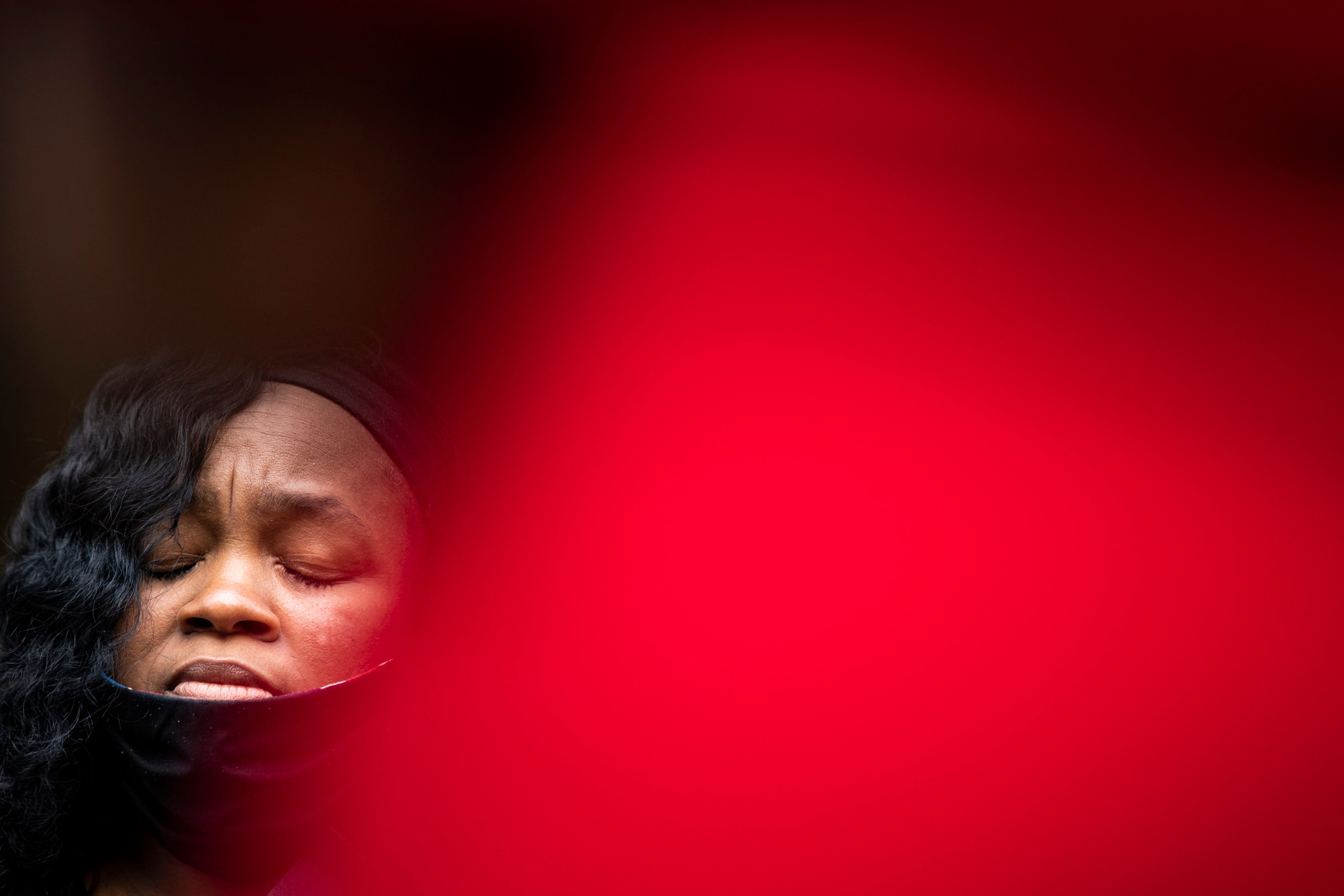 Breonna Taylor's mother, Tamika Palmer, clinches her eyes shut during a press conference regarding her daughter's case outside City Hall. Aug. 13, 2020