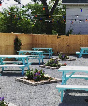 Ice Cream Social, the new outdoor patio behind At Random at 2501 S. Delaware Ave., has distanced picnic tables, multicolored lights and walk-up windows for service.