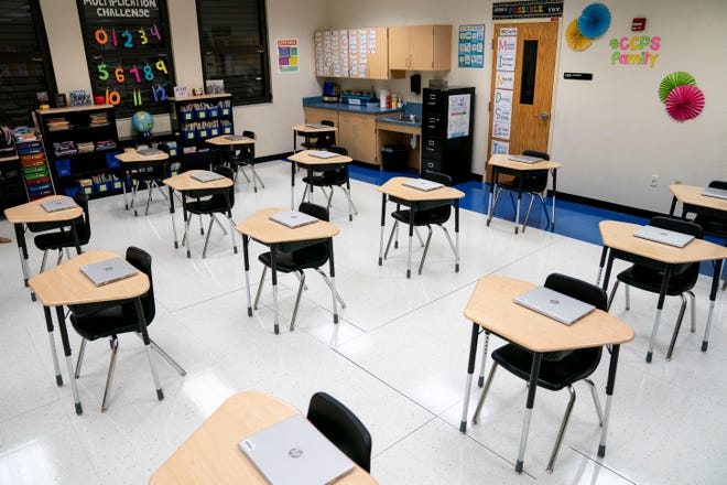 Laptops sit out on desks in a third grade classroom during a tour to highlight coronavirus precautions being implemented by Collier County Public Schools throughout the district at Mike Davis Elementary School near Golden Gate on Thursday, August 13, 2020. Each student from first through 12th grade will have a laptop to use at school and take home with them, and younger students will have tablets. 