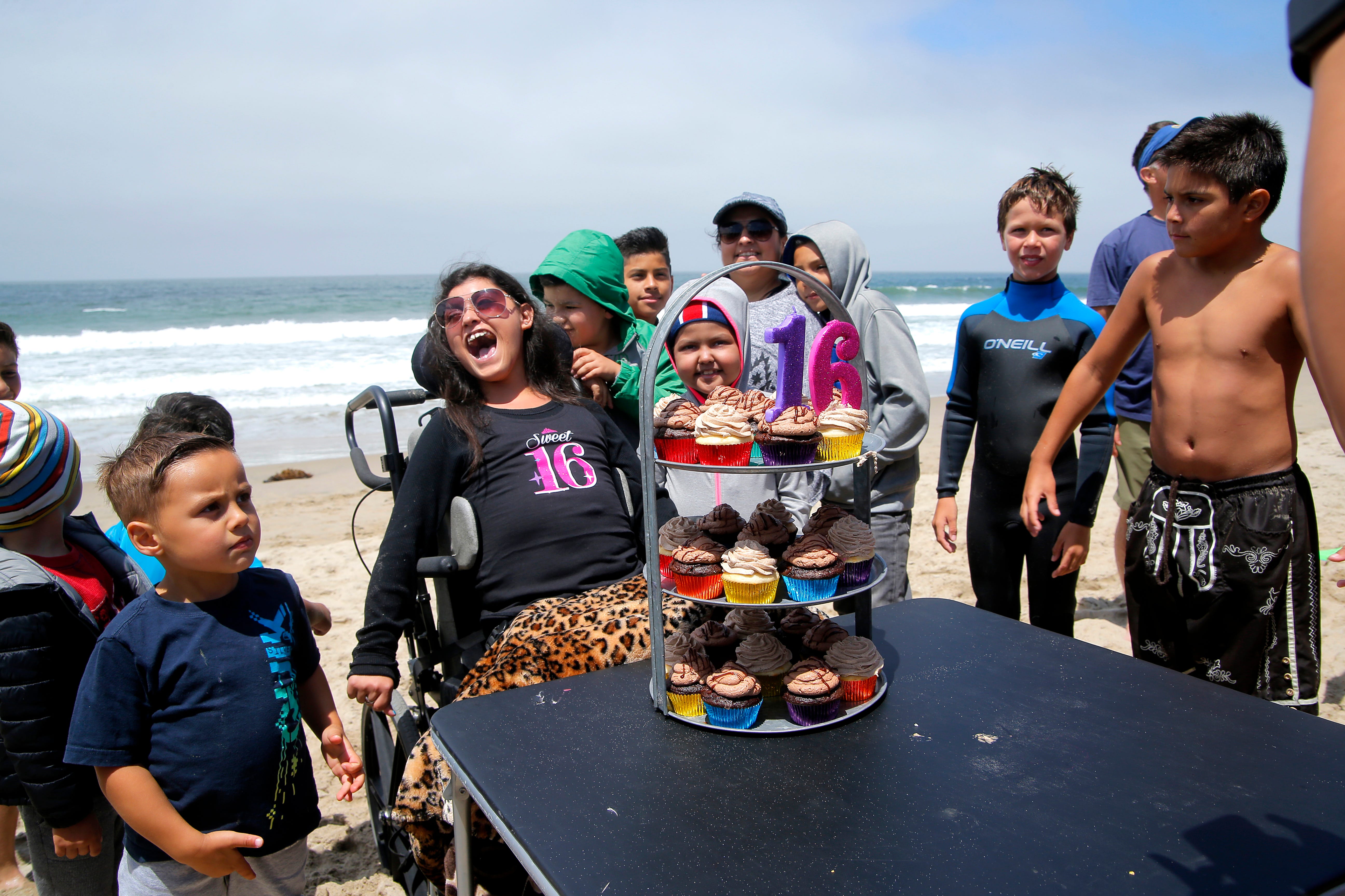 Karizma Vargas celebrates her 16th birthday party surrounded by friends and family on a beach in Monterey Bay.