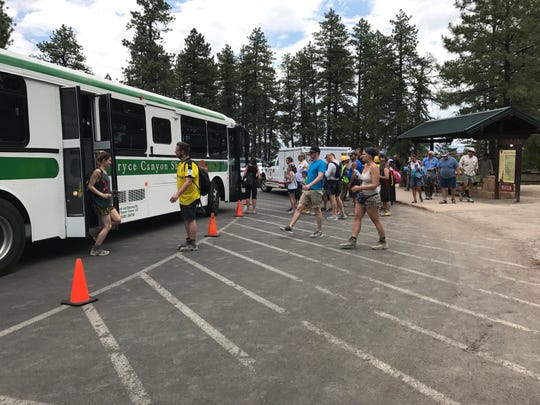 Passengers board Bryce Canyon National Park Shuttles, which were replaced in 2016.