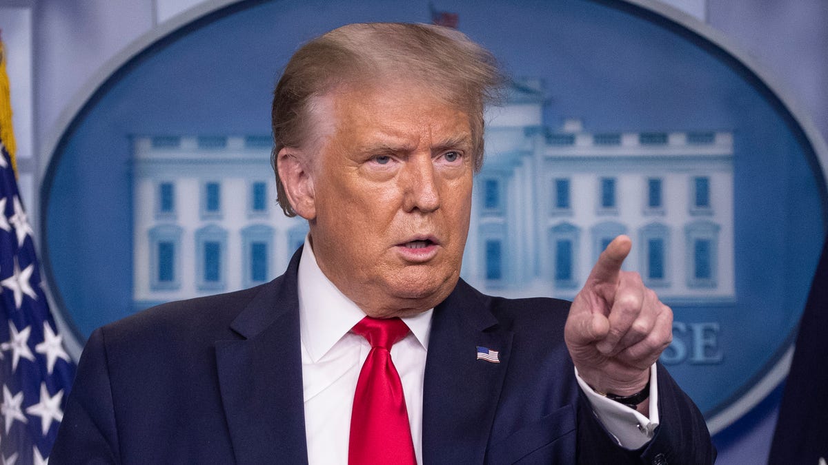 FILE - President Donald Trump points to a question as he speaks during a briefing with reporters in the James Brady Press Briefing Room of the White House.  TikTok and its U.S. employees are planning to take the Trump administration to court over a sweeping order that could ban the popular video app, according to a lawyer preparing one of the lawsuits.