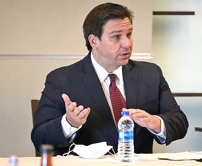 Gov. Ron DeSantis, seen here during a Sarasota discussion in August, included three health experts who have expressed dissenting viewpoints from the mainstream scientific community in a Thursday virtual roundtable talk on COVID-19.