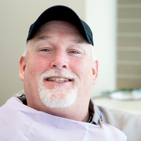 Dean Gillispie smiles after his teeth were cleaned by Dentist Henry Briggs III on for free as part of Smile Generation's serve day on Saturday, Aug. 15, 2020, at Dentists of Westwood in Westwood. Dentists of Westwood donated dentistry to a Gillispie, who was wrongfully incarcerated for 26 years and has been exonerated, as part of Smile Generation Serve Day.  "In prison dental work is pretty much nonexistent," Gillispie said, "I've been   out now for eight and a half years and I'm finally getting my teeth cleaned." As part of Smile Generation tenth annual serve day, Dentist Henry Briggs III and Dentists of Westwood provided oral health care to Gillispie, who spent over two decades behind bars for a crime he did not commit. "To have organizations like After Innocence, Smiles Generation, and these great dentist offices who will volunteer their time to do this stuff is amazing,"  Gillispie said. Gillispie was convicted of robbery and kidnapping in 1991 when he was in his mid-twenties and spent 20 years in prison before his release in December of 2011 on bond after being granted a new trial. Gillispie was   exonerated in 2017. "We are better off to be out on parol where you have services but if you are exonerated you have nothing, it's like you don't exist," Gillispie said.