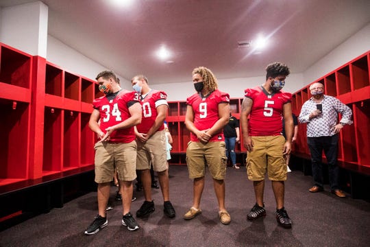 North Fort Myers High School football players from left, Hoss Davis, Cash Davis, Paxton Walker and Vinny Husband take a look at the newly renovated locker room of the Ron Hoover Field House  on Saturday, August 15, 2020. The whole field house was renovated with donations from the community. Two major contributors were former player and NFL fullback Tommy Bohanon and NFMHS graduate Ronnie Johnson.