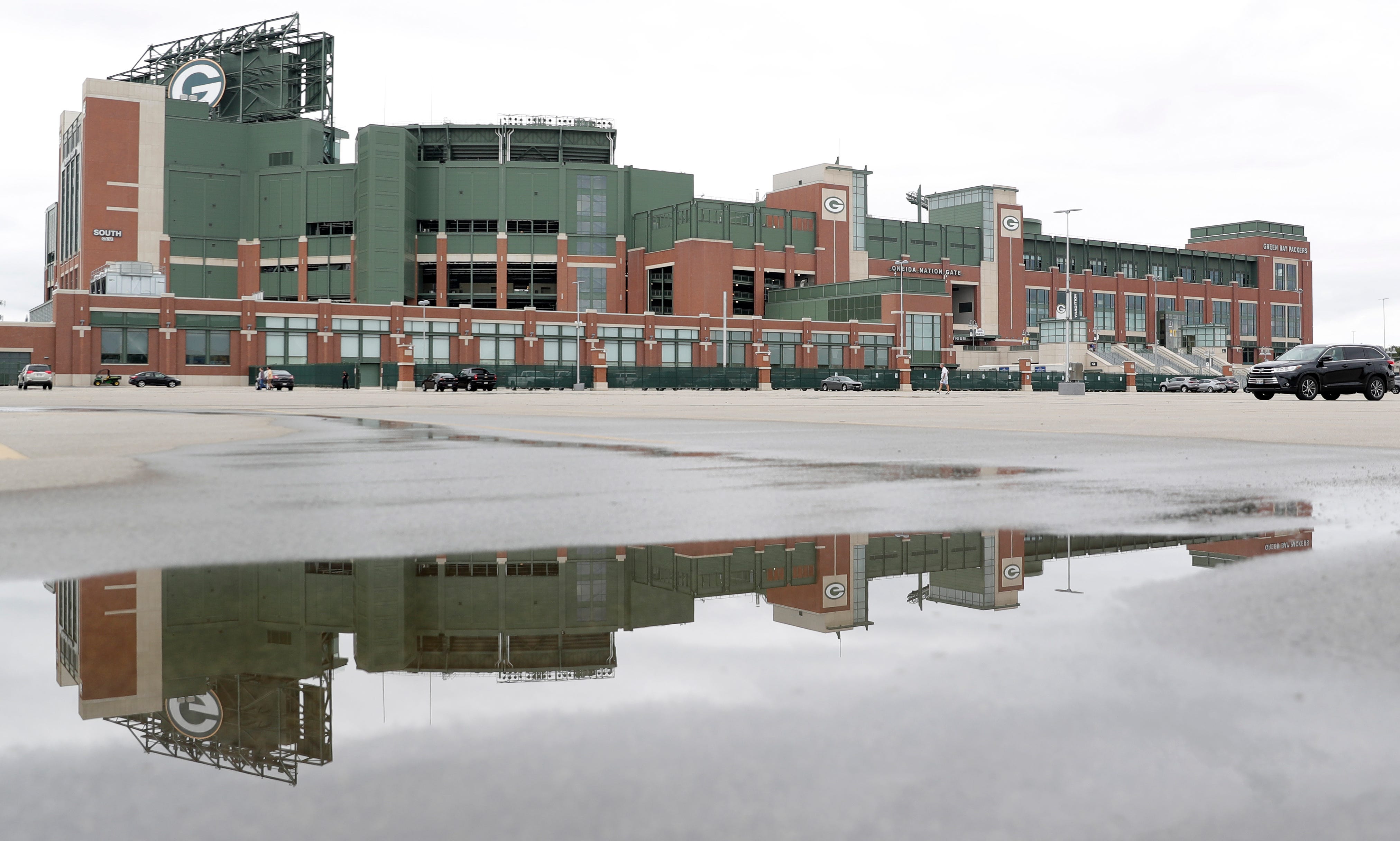 The parking lot at Lambeau Field sits mostly empty on Aug. 15, 2020, in Green Bay, Wis. The Green Bay Packers began their first practice of training camp at Ray Nitschke Field, but with no public viewing due to the coronavirus pandemic, only a few fans visited the area.