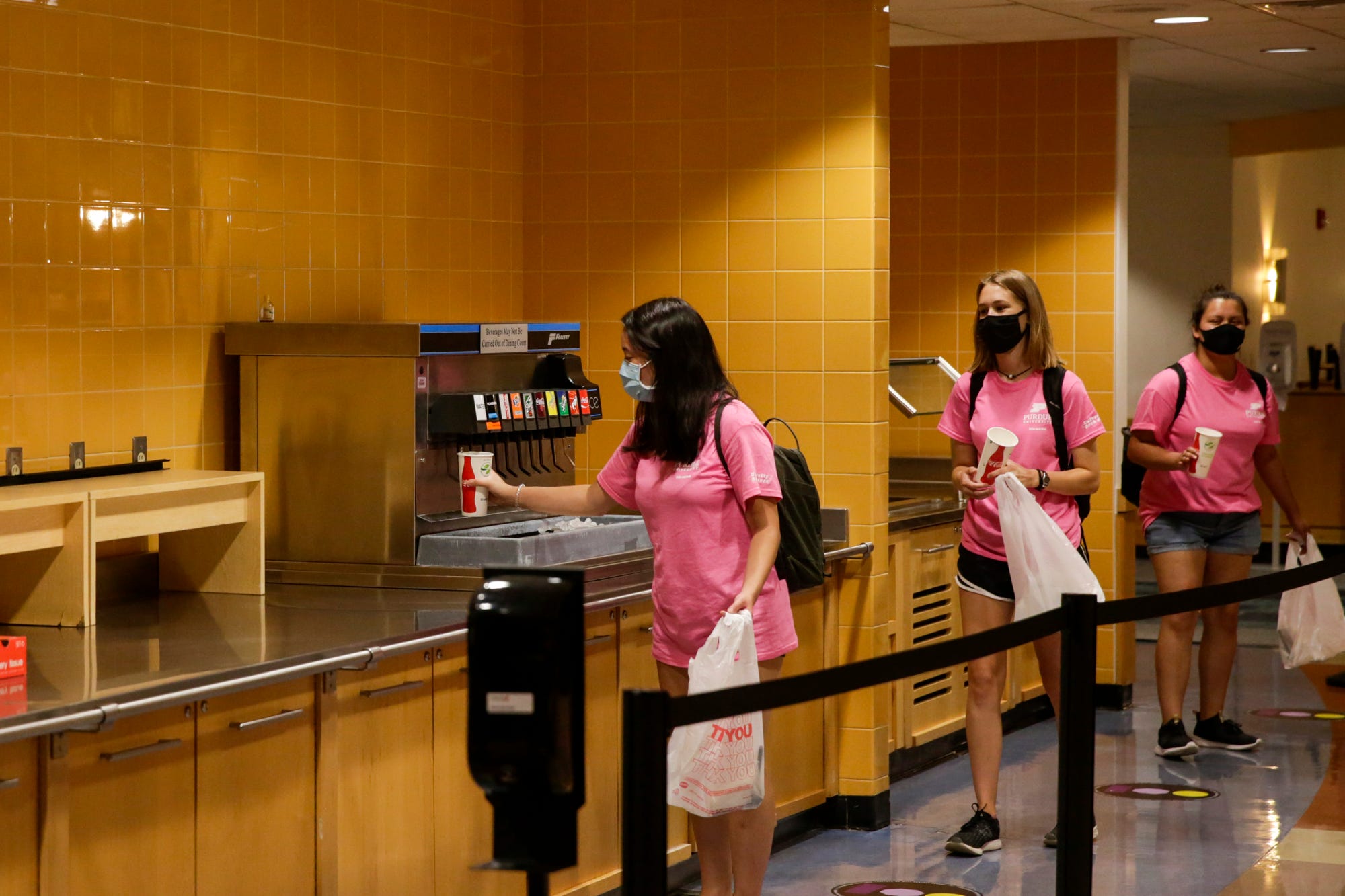 Students queue inside Earhart Dining Hall for lunch Aug. 13 at Purdue University in West Lafayette.