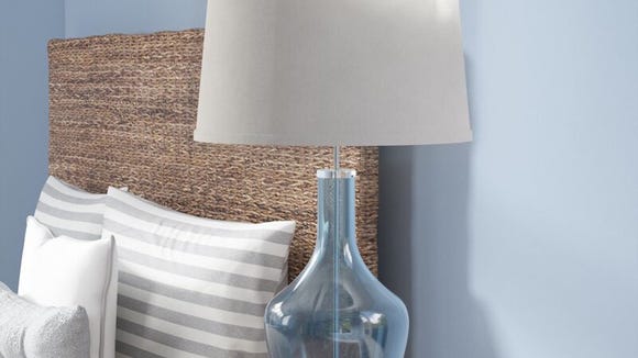 Choose from 10 different colored lamp shades in this bedside lamp;
