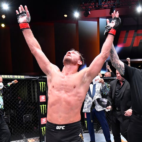 Stipe Miocic celebrates after his victory over Dan